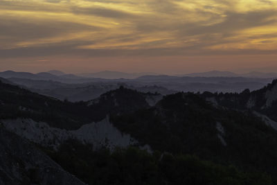 Scenic view of mountains against sky during sunset