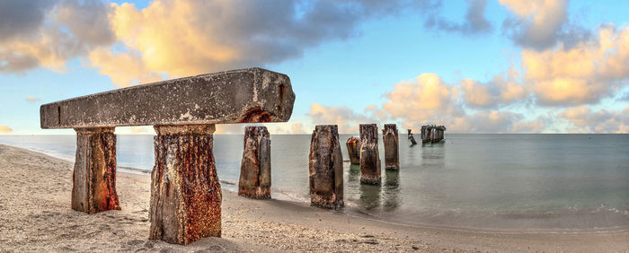 Sunset over old abandoned stone fishing pier called bocahenge is l shaped and found in boca grande 