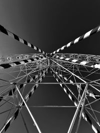 Low angle view of ferris wheel against sky at night