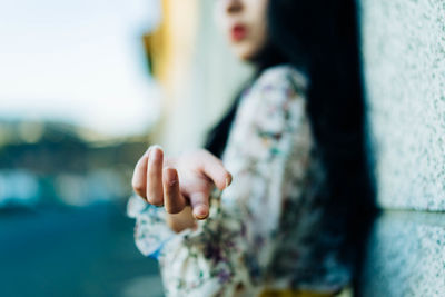 Close-up of woman holding hands