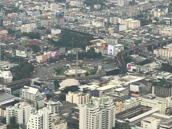 High angle view of crowd and buildings in city