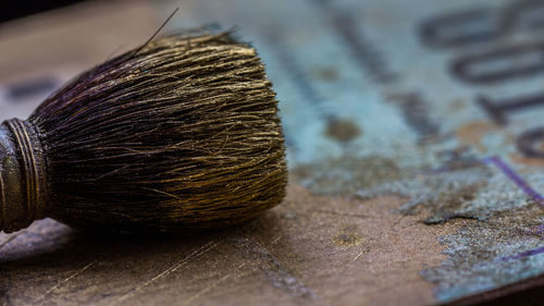 Close-up of brush on table
