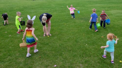 Siblings playing on grass