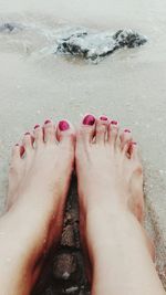 Low section of woman at beach