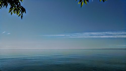 Scenic view of sea against blue sky