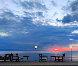 Scenic view of beach against sky during sunset