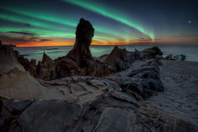 Scenic view of sea against sky at sunset