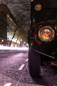 Illuminated city street at night