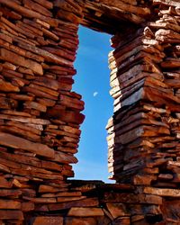 Low angle view of stack of building against sky