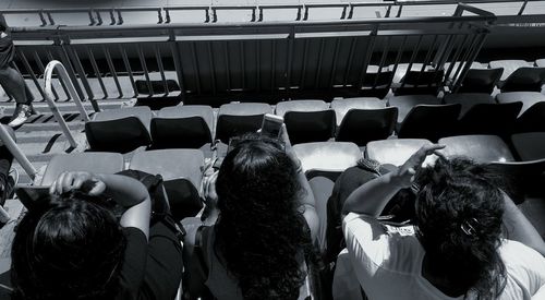 Rear view of people walking on seat