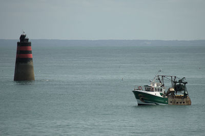 Fishermen boat enters the harbor 