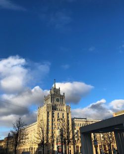 Low angle view of building against cloudy sky
