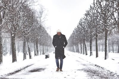 Portrait of man in snow covered park