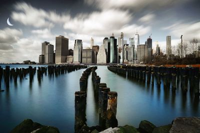 Panoramic view of sea and buildings against sky