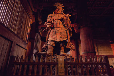 Low angle view of statue against building