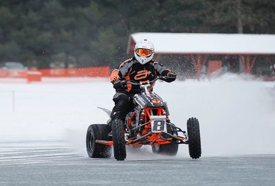 Man riding motorcycle on water