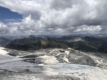 Aerial view of snowcapped mountains against sky