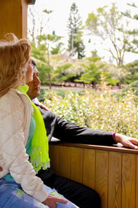 Mature couple sitting by window