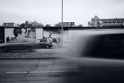 Cars on road against sky