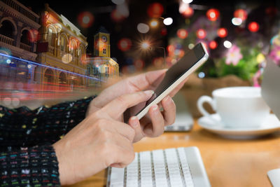 Close-up of man using mobile phone