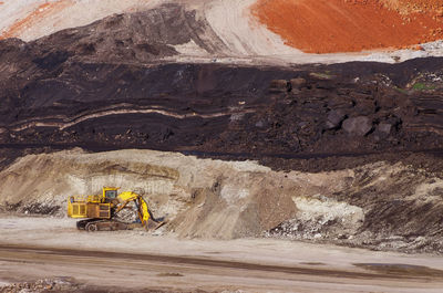 High angle view of earth mover digging land