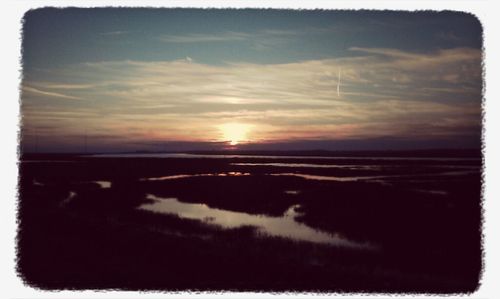 Scenic view of landscape at sunset