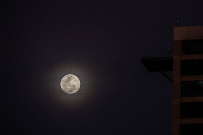 Low angle view of moon against sky at night