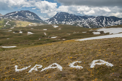 Scenic view of snowcapped mountains against sky