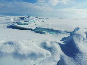 Scenic view of frozen lake against sky