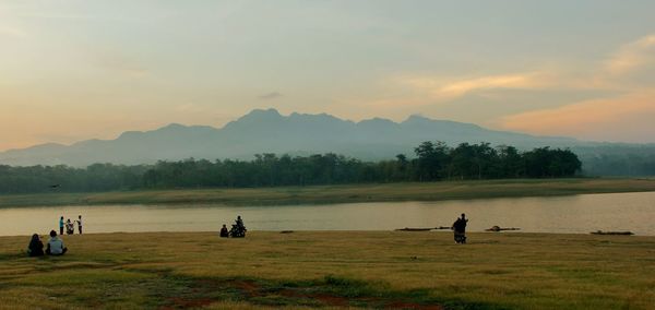 Scenic view of lake against sky during sunset