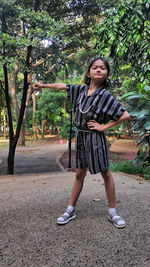 Asian girl posing in a park with natural background