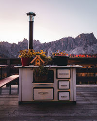 Built structure against mountain range against clear sky