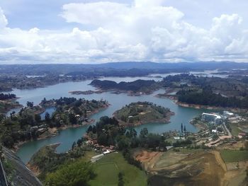 Panoramic view of sea and cityscape against sky