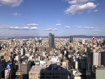 High angle view of modern buildings in city against sky