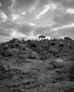 Panoramic view of rocks on landscape against sky