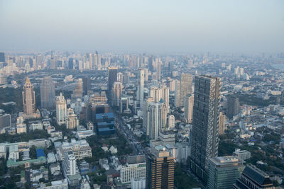 High angle view of modern buildings in city against sky