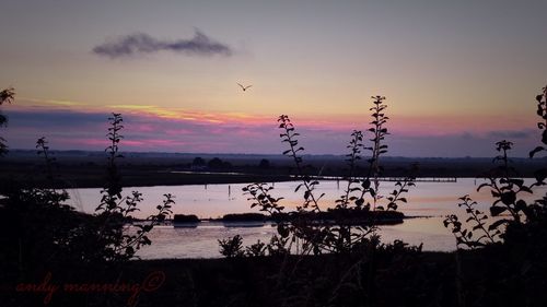 Scenic view of sea at sunset