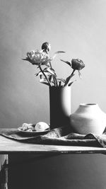 Flower vase on table at home