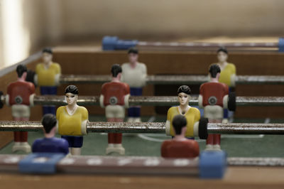 Close-up of figurines on foosball table