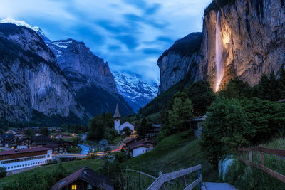 The view of lauterbrunnen and village town and staubbach waterfall taken in the morning. 