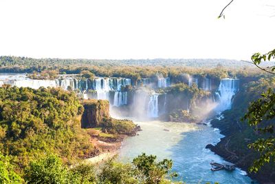 Scenic view of waterfall against clear sky