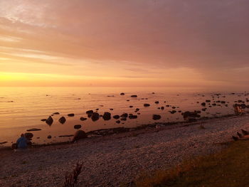 Scenic view of sea at sunset