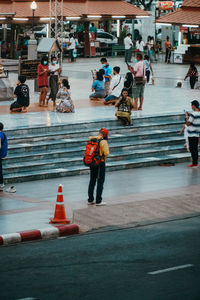 People walking on road in city