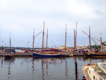 Boats moored at harbor