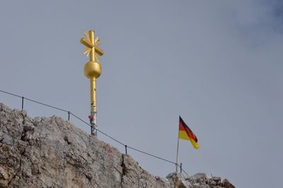 Low angle view of pole against blue sky