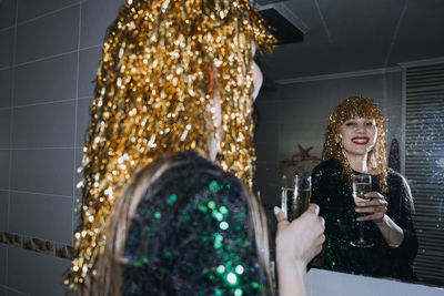 Happy new year. new year eve party celebration. beautiful woman with holiday makeup and gold shiny