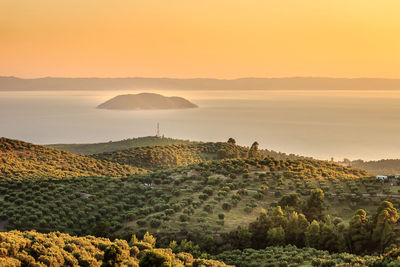 Scenic view of landscape against sky during sunset