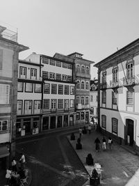 Buildings in city against clear sky