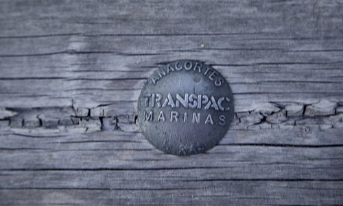 Close-up of text on wooden table