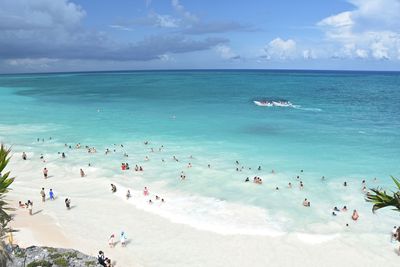 High angle view of people enjoying on beach